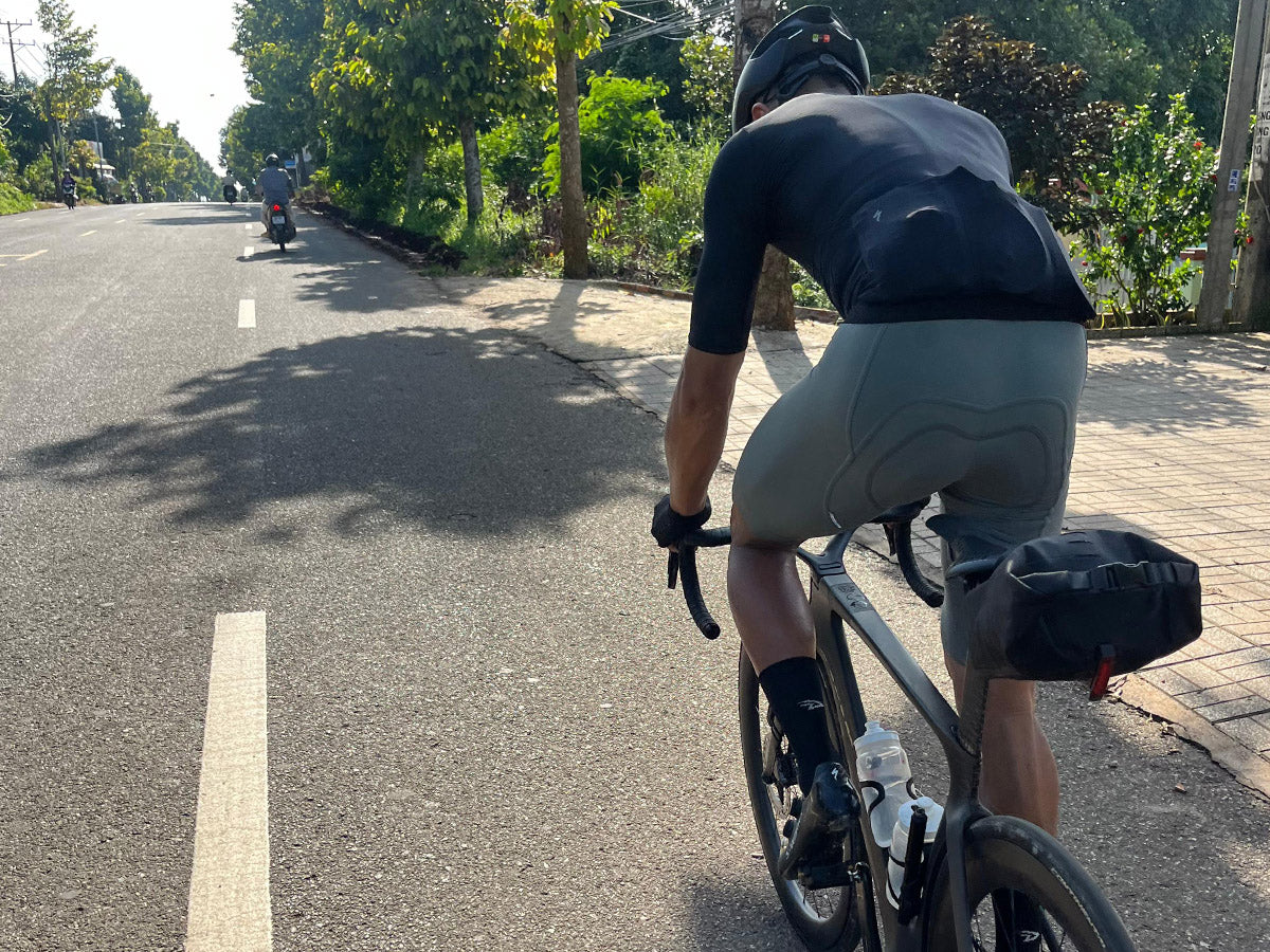 The Post Carry Co. Seat Pack mounted under the saddle of a Cervelo road bike shown from the back