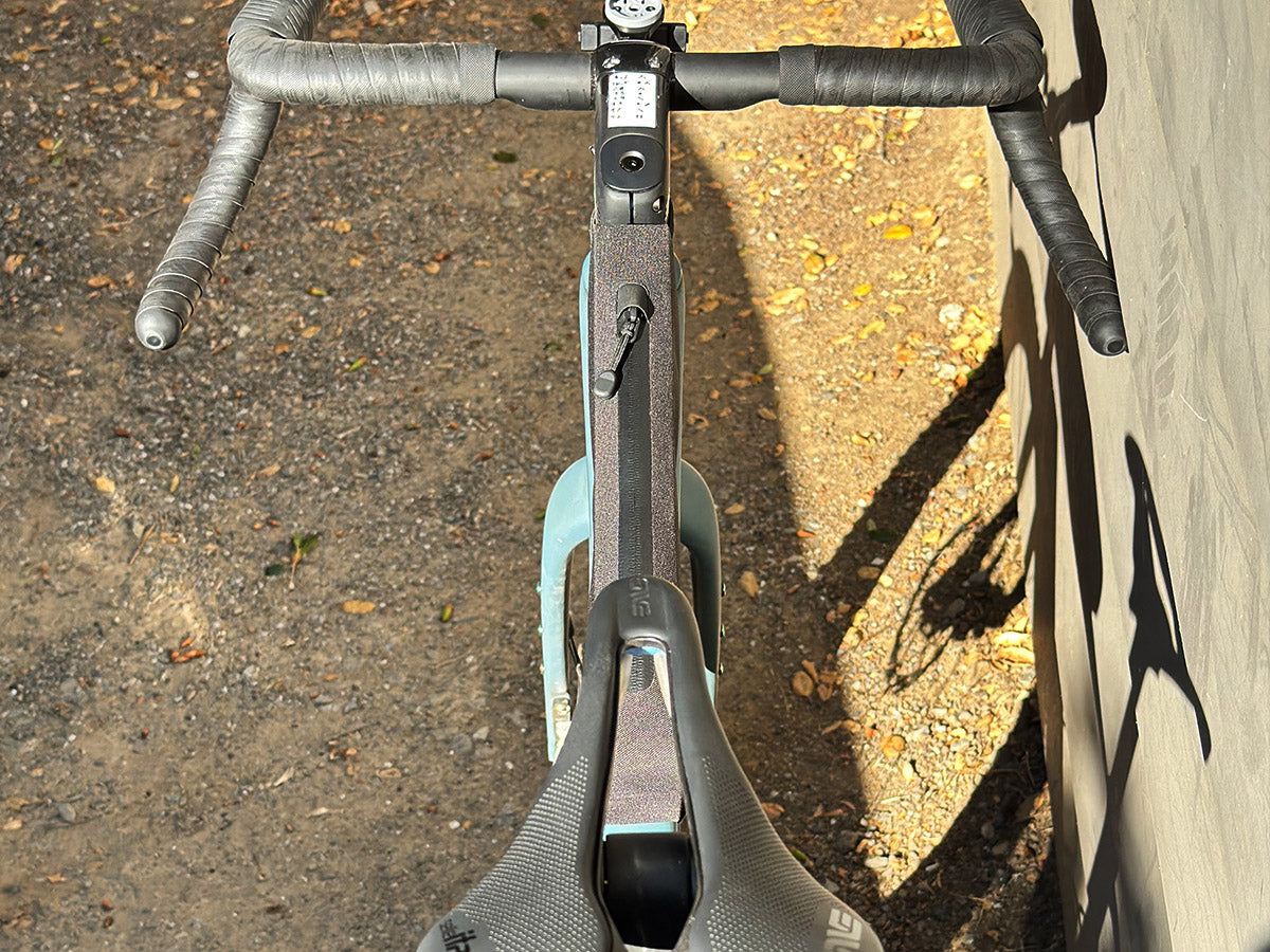 The Post Carry Co. Top Tube Pack mounted above the top tube of an Enve gravel bike shown from the top