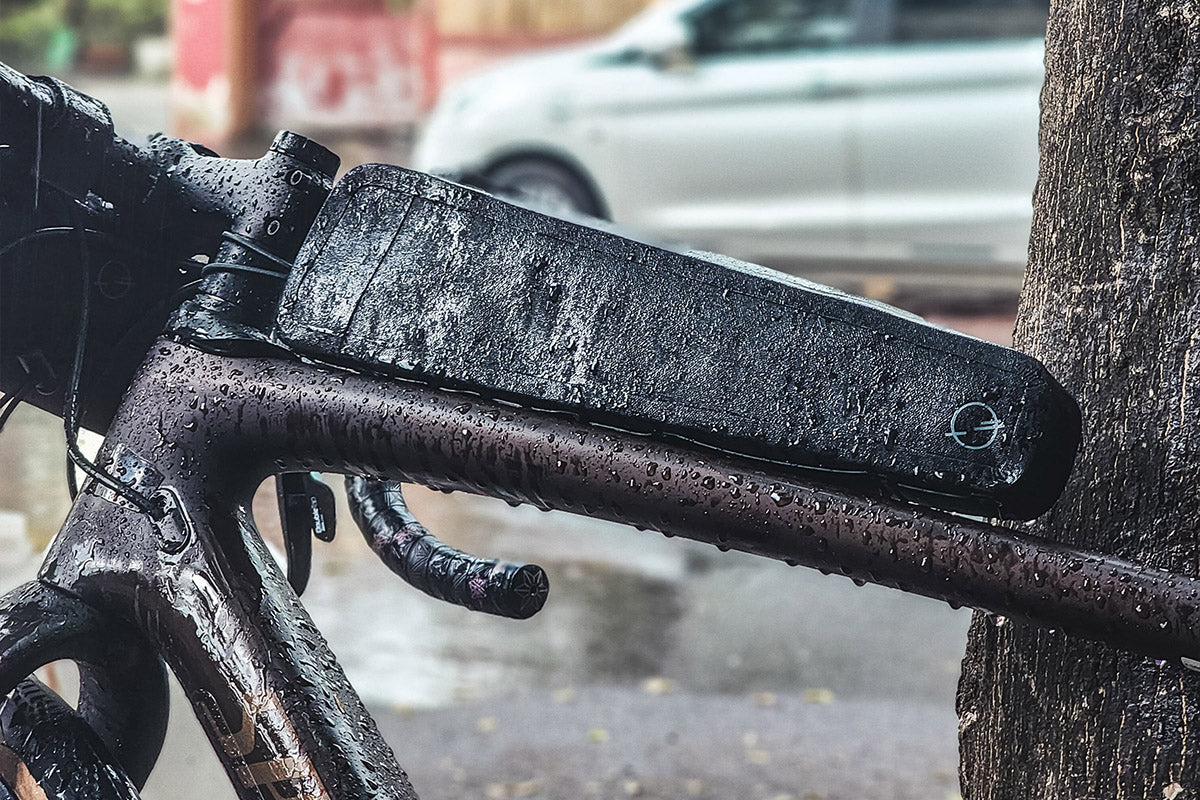 Side view of the Post Carry Co. Slim Top Tube Pack mounted on a bicycle