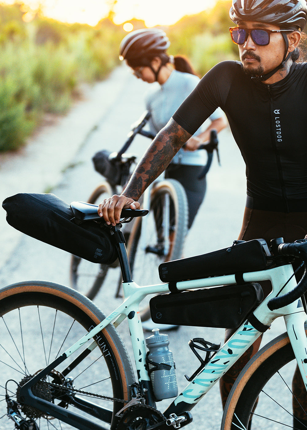 Side view of the Post Carry Co. Seat Pack, Slim Frame Pack and Top Tube Pack mounted on a bicycle
